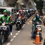 What business are companies like GRAB and GOJEK in?